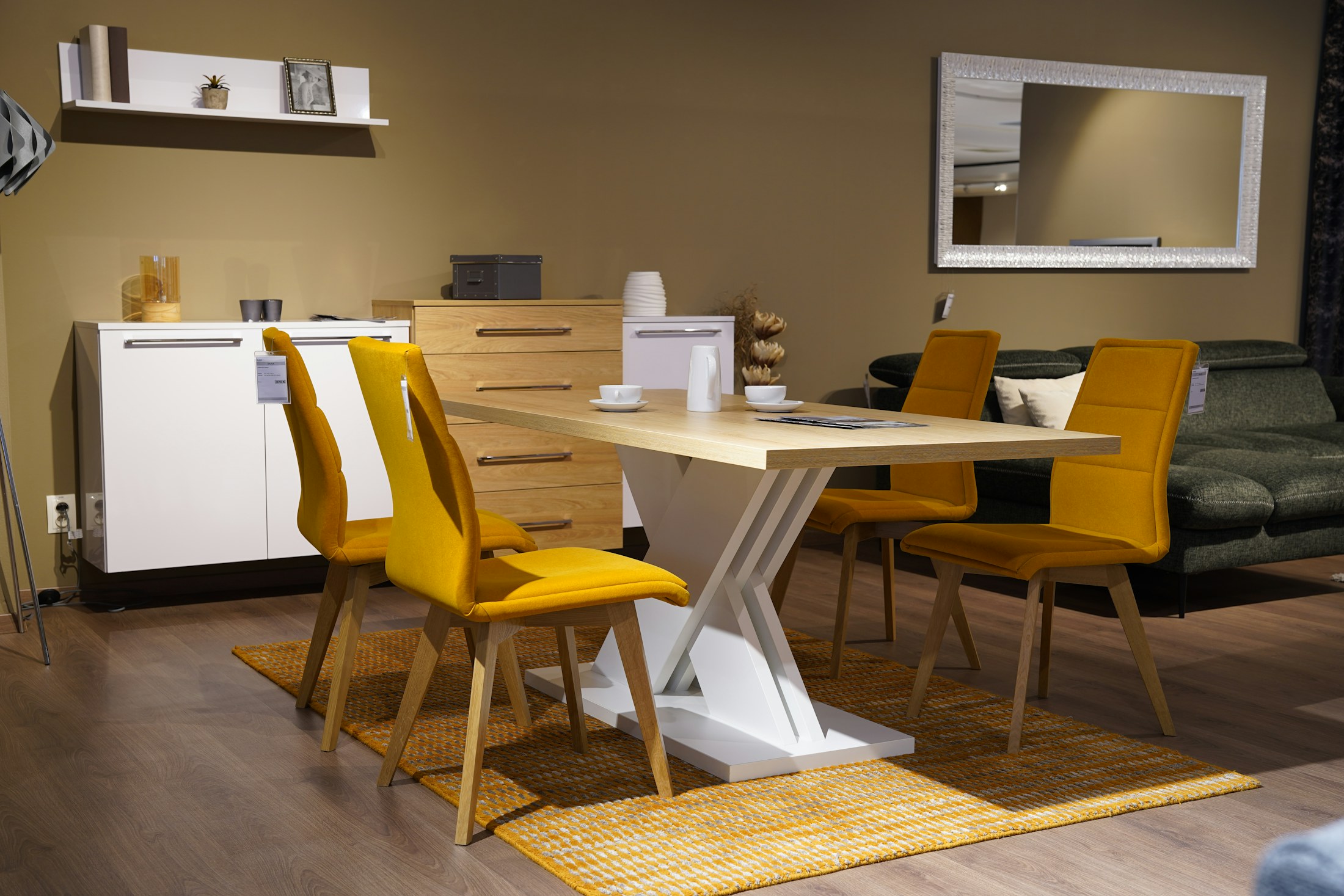 A showroom setting with timber tables, chairs and display furniture