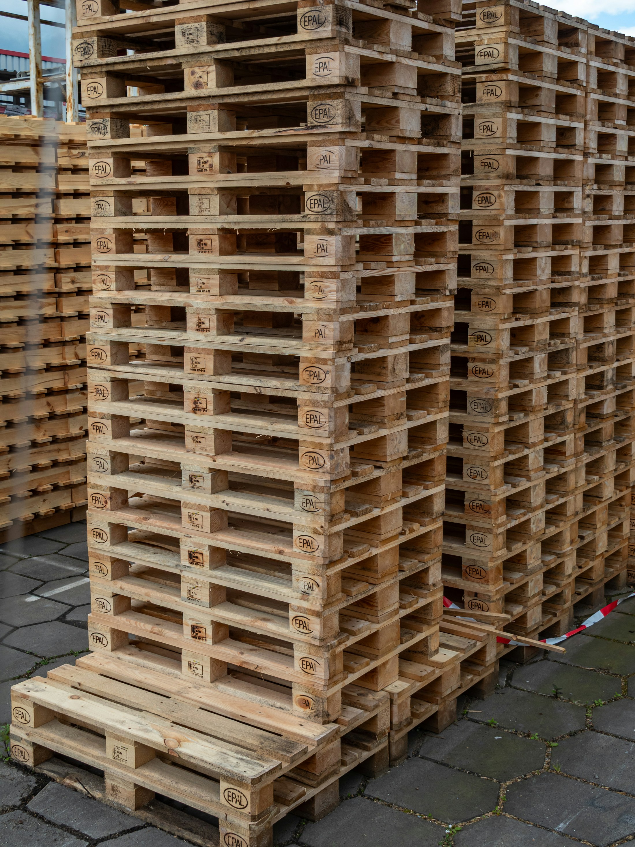 Stacked timber pallets ready for reuse